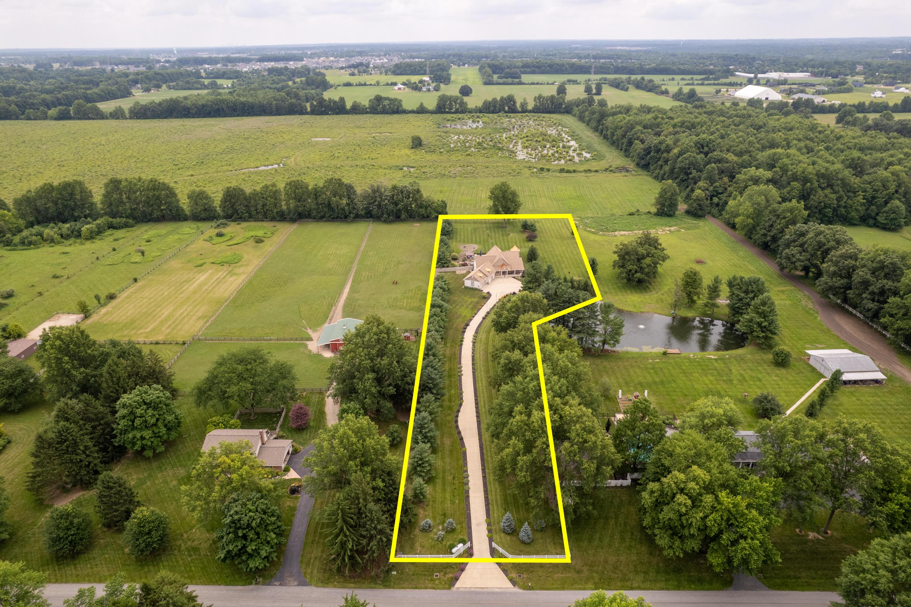 4640 Maynard Road Delaware, OH 43015 - Photo 88 of 91 Sprawling estate featuring a grand main residence with an expansive lawn, a long private driveway, and mature landscaping