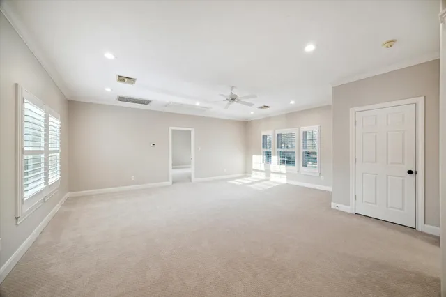 a view of empty room with windows