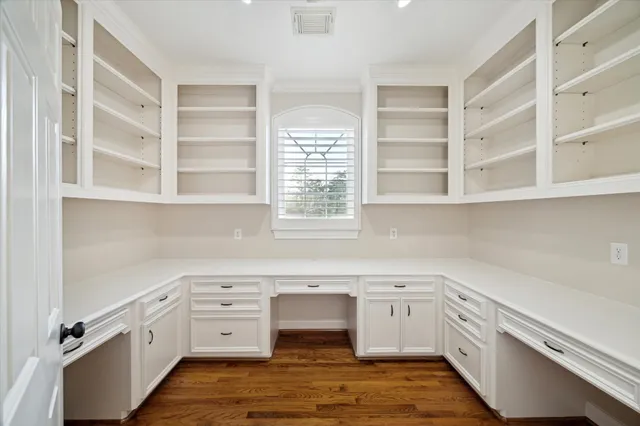 a view of white cabinets and window