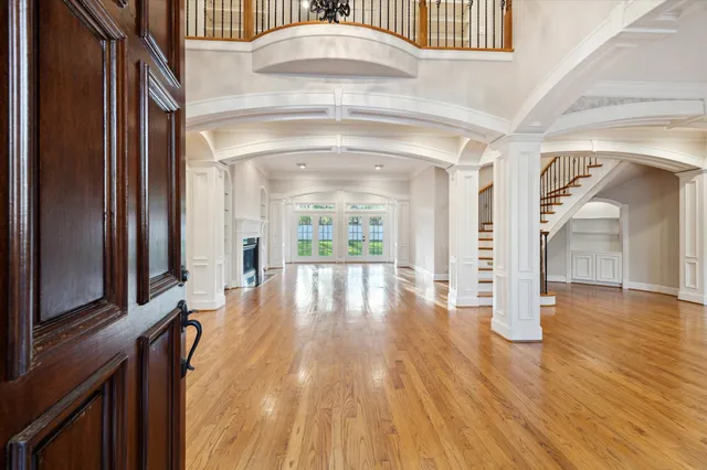 a view of an entryway with wooden floor