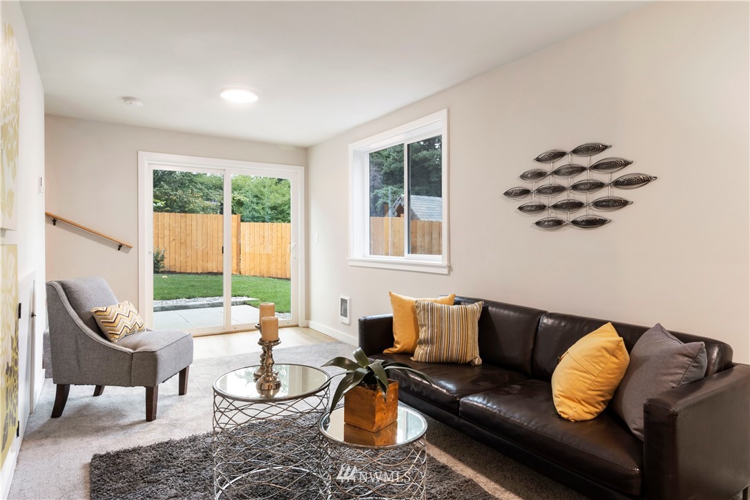 15 231st Street Southeast Bothell, WA 98021 - Photo 22 of 26 a living room with furniture and a large window