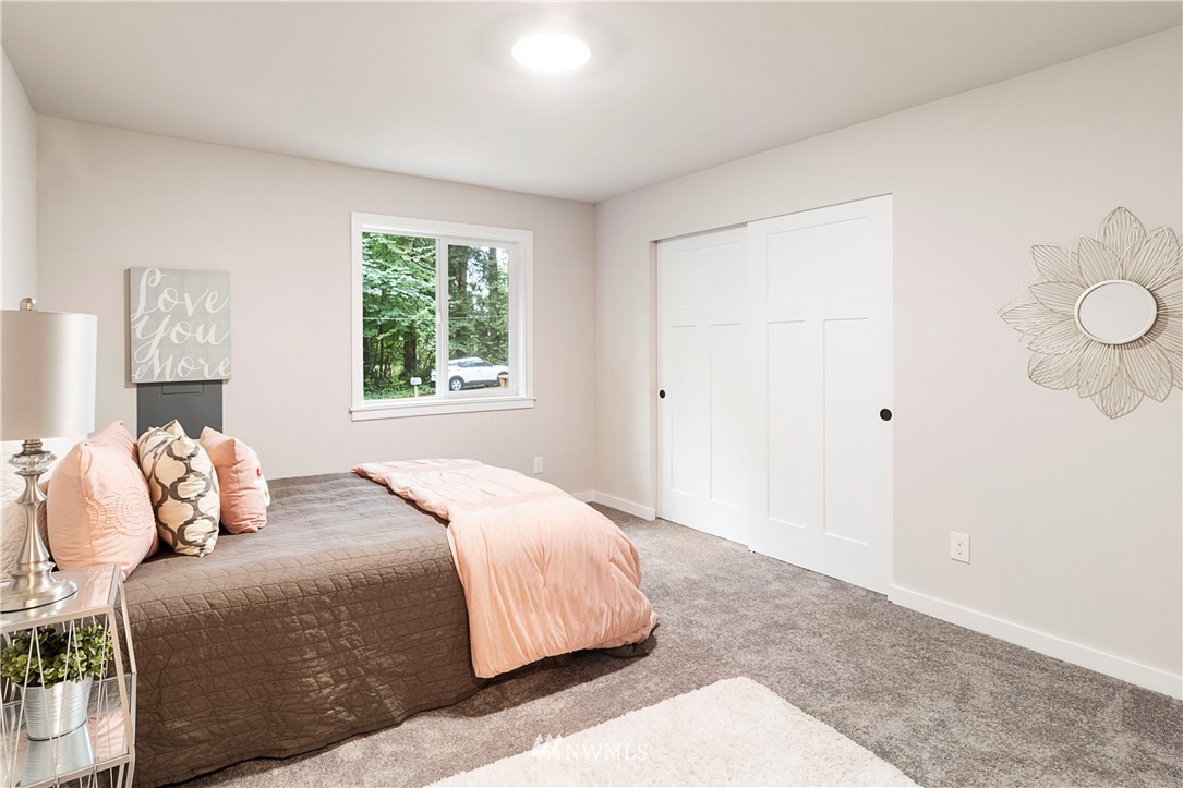 15 231st Street Southeast Bothell, WA 98021 - Photo 10 of 26 a bedroom with a bed and a window