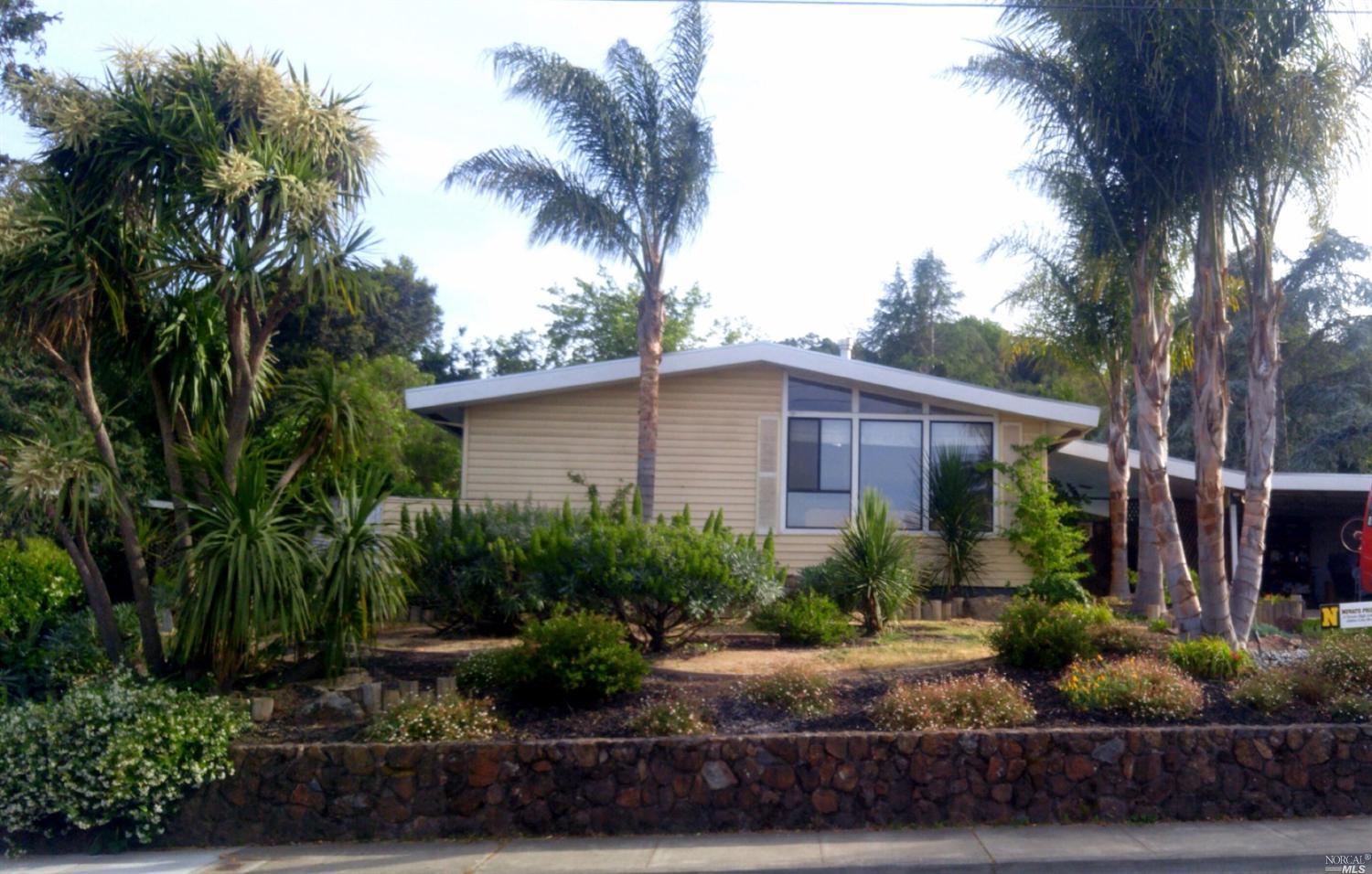 1687 Hill Road Novato, CA 94947 - Photo 1 of 1 a front view of a house with garden