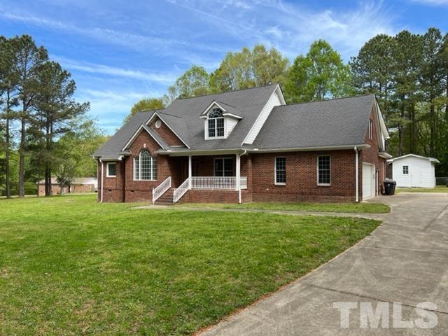 4820 Bluetick Road Raleigh, NC 27616 - Photo 1 of 36 a front view of a house with a garden