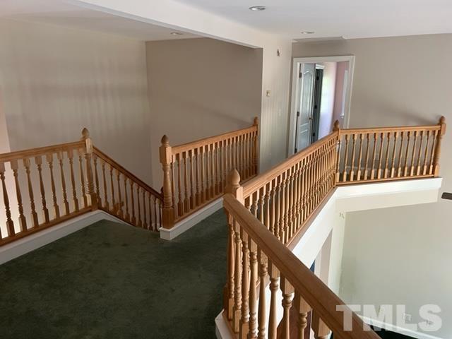 4820 Bluetick Road Raleigh, NC 27616 - Photo 16 of 36 a view of staircase with railing and a window
