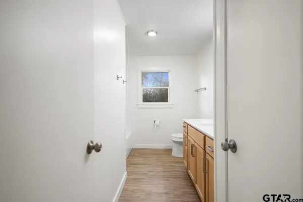 a view of a bathroom from the hallway