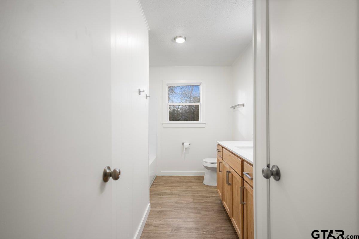 585 Highway 149 Tatum, TX 75691 - Photo 14 of 45 a view of a bathroom from the hallway