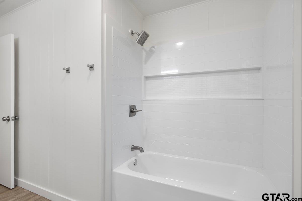 585 Highway 149 Tatum, TX 75691 - Photo 16 of 45 a bathroom with a bathtub