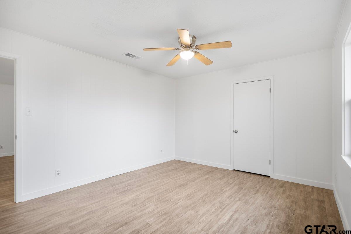 585 Highway 149 Tatum, TX 75691 - Photo 30 of 45 wooden floor in an empty room