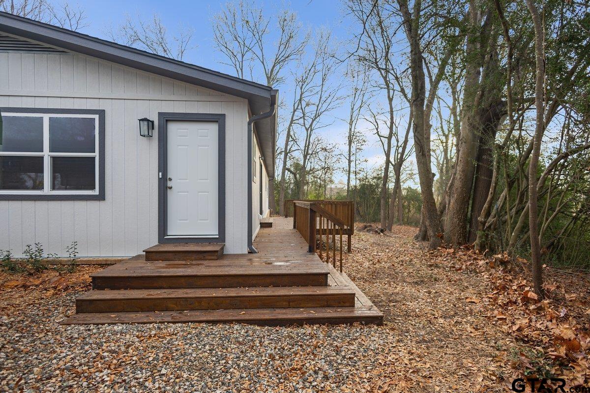 585 Highway 149 Tatum, TX 75691 - Photo 36 of 45 a front view of a house with a garden