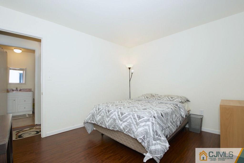 135 Drake Road Somerset, NJ 08873 - Photo 11 of 16 a bed sitting in a bedroom next to a window
