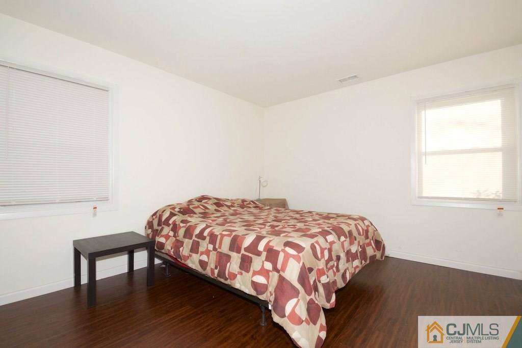 135 Drake Road Somerset, NJ 08873 - Photo 12 of 16 a bedroom with a bed and a window