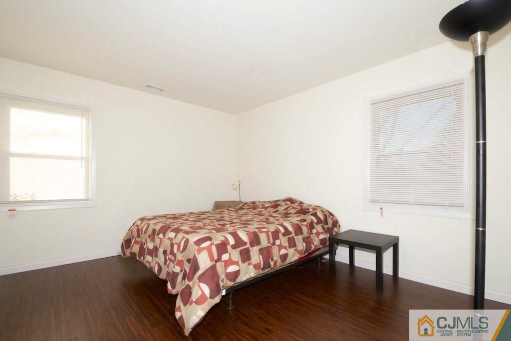 135 Drake Road Somerset, NJ 08873 - Photo 13 of 16 a bedroom with a bed and a table