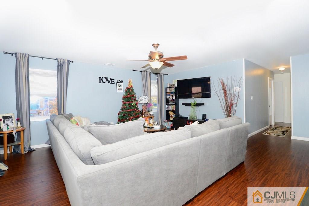 135 Drake Road Somerset, NJ 08873 - Photo 3 of 16 a living room with furniture and a flat screen tv