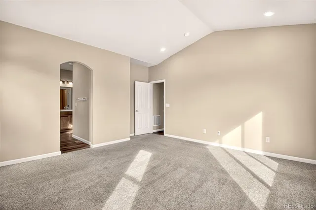 a view of a big room with closet and windows