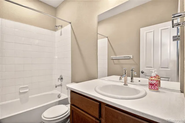 a bathroom with a sink a toilet and a bathtub