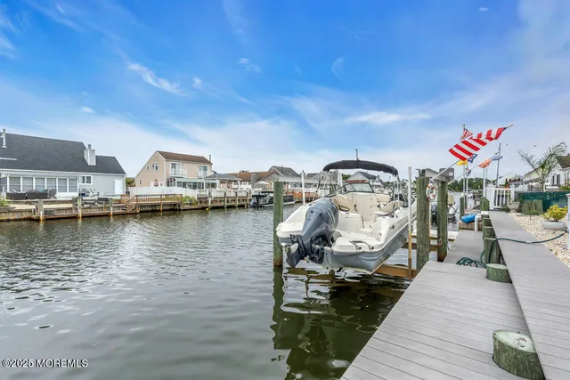 a view of a lake with boats and trees in the background