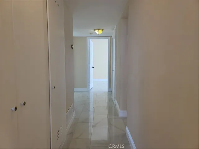 a view of balcony with wooden floor and fence