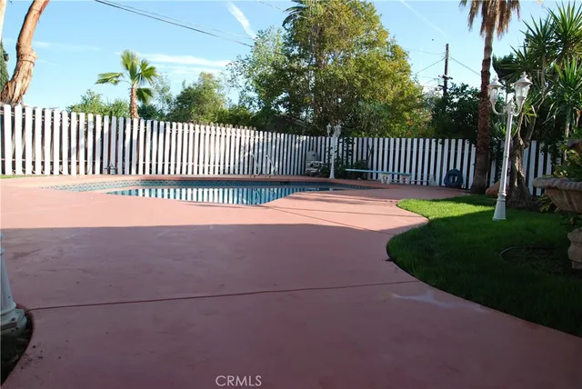 a view of swimming pool from a balcony