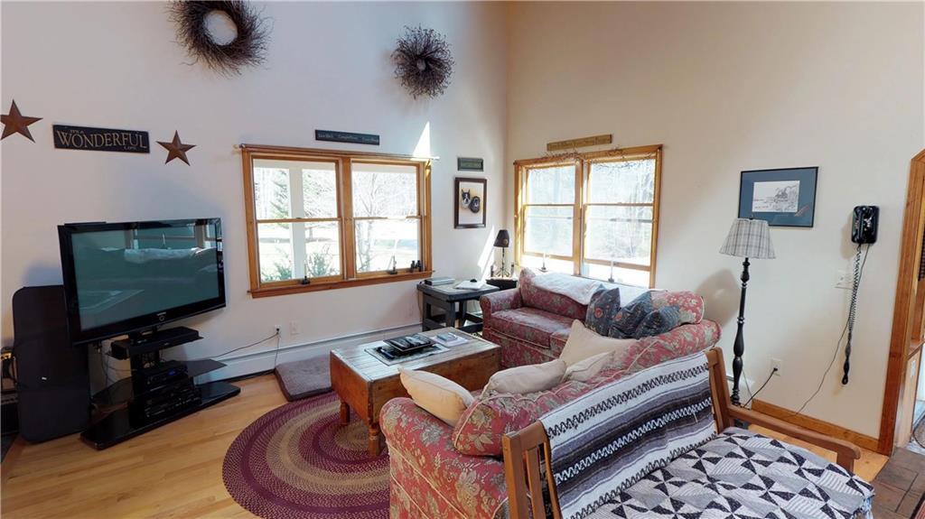 411 Governor Goodwin Road North Berwick, ME 03906 - Photo 13 of 29 The living room is open to the kitchen.