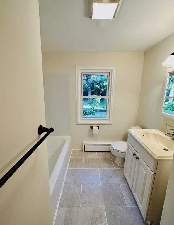 209 Birch Road Longmeadow, MA 01106 - Photo 7 of 13 a bathroom with a bathtub sink and toilet