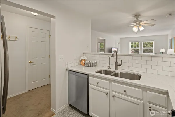 a kitchen with a sink and cabinets