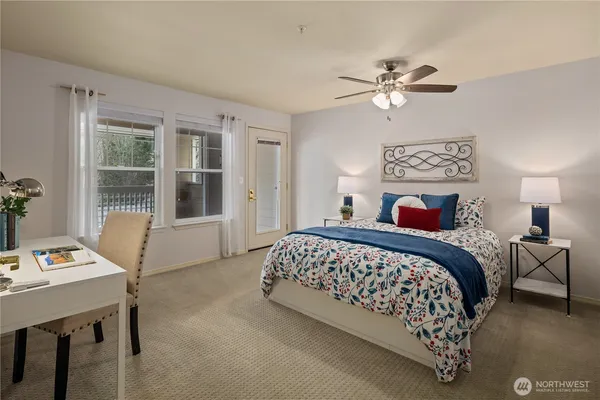 a bedroom with a bed and a window