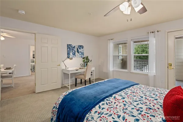 a bedroom with a bed and a table