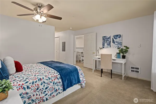 a bedroom with a bed and a chandelier
