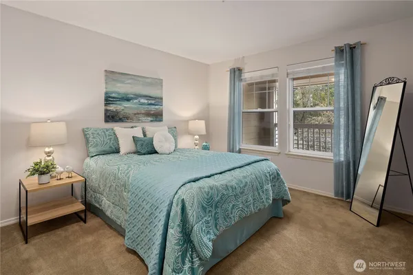 a bedroom with a bed and window