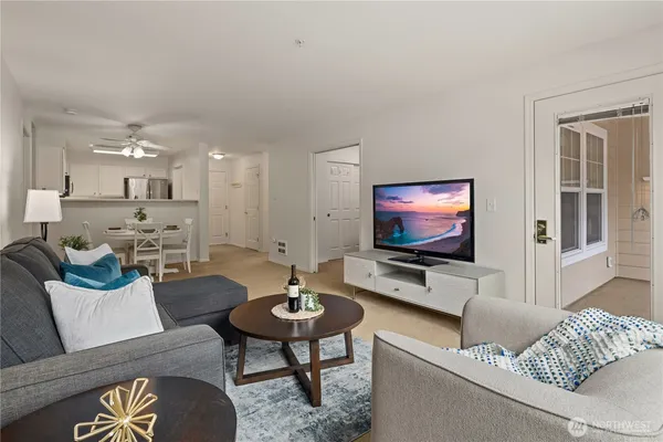 a living room with furniture and a flat screen tv