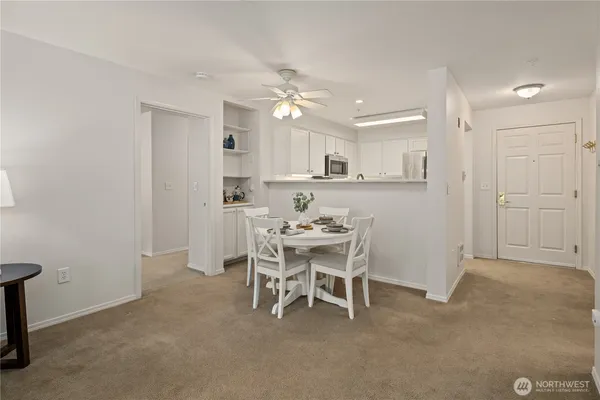 a dining room with furniture and window