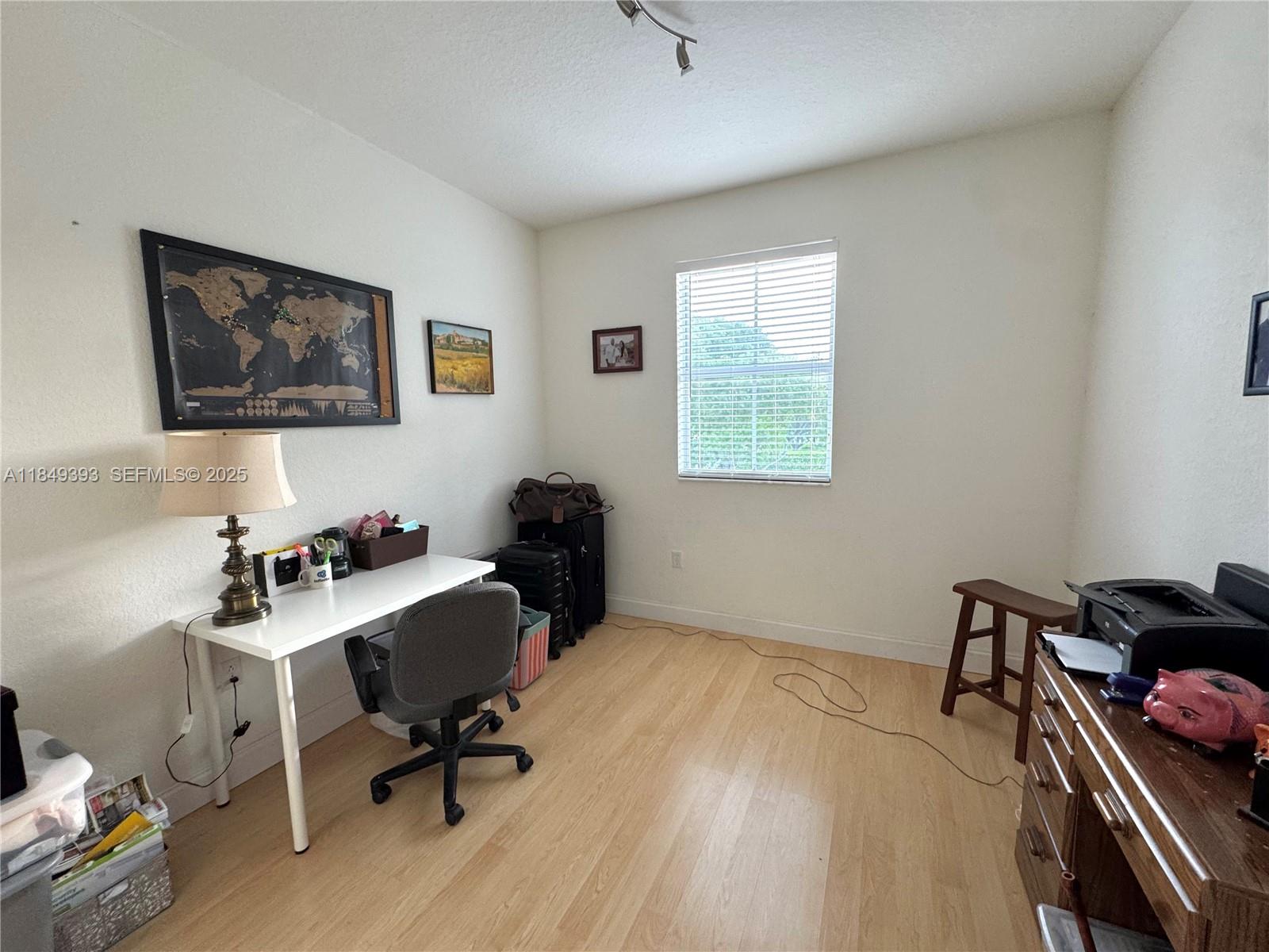11575 Southwest 138th Avenue Miami, FL 33186 - Photo 11 of 23 a view of a workspace with furniture and a window