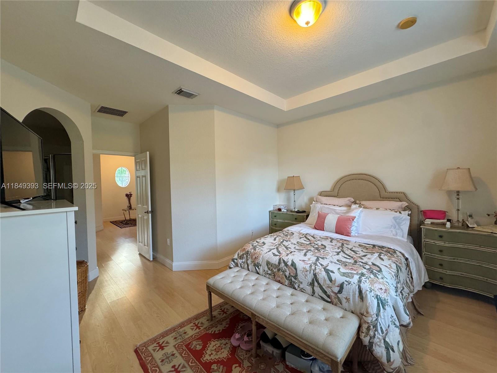 11575 Southwest 138th Avenue Miami, FL 33186 - Photo 13 of 23 a bedroom with a bed and wooden floor