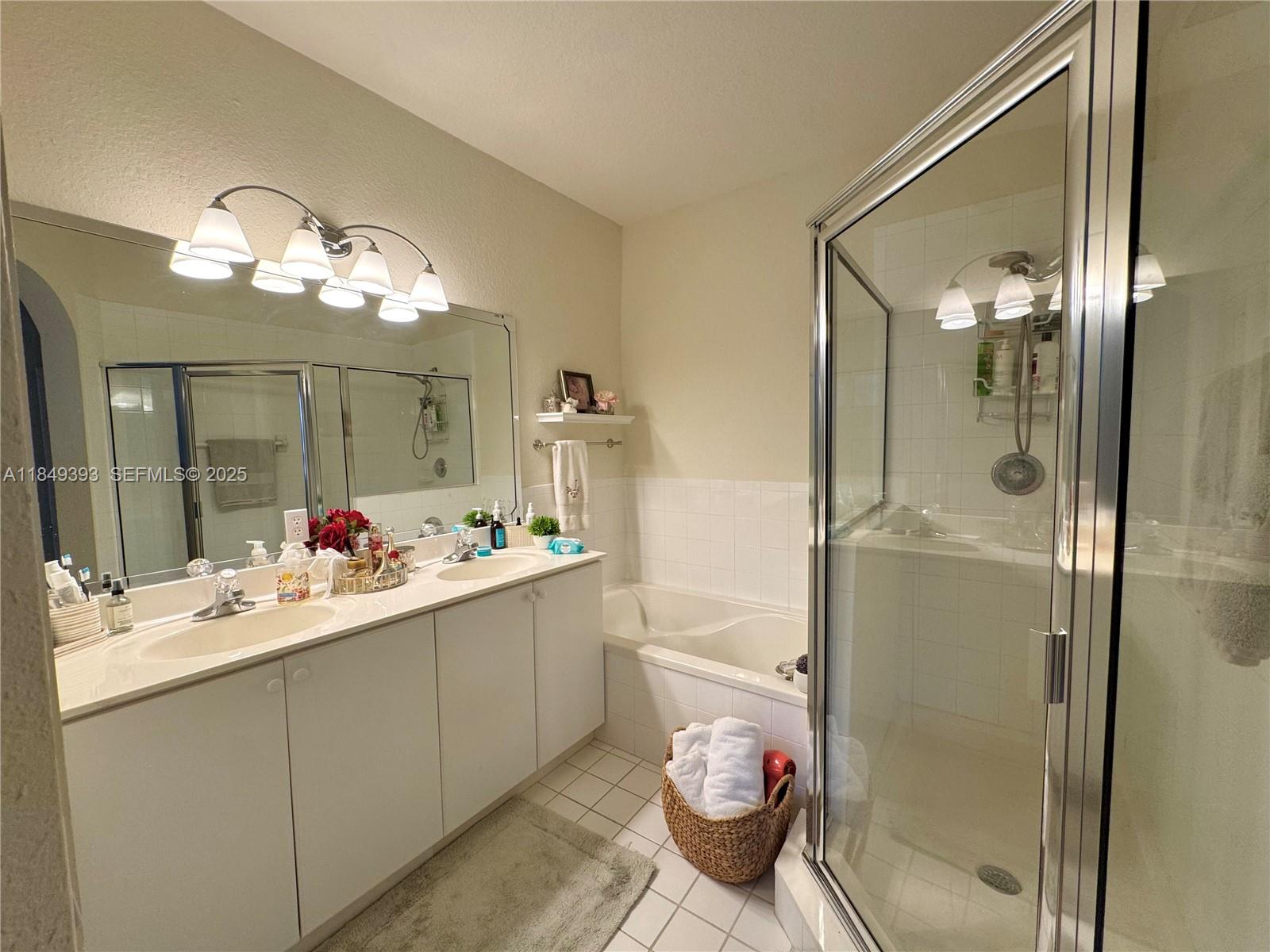 11575 Southwest 138th Avenue Miami, FL 33186 - Photo 15 of 23 a bathroom with a sink vanity granite toilet and shower