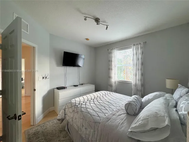 a bathroom with a sink toilet and a mirror