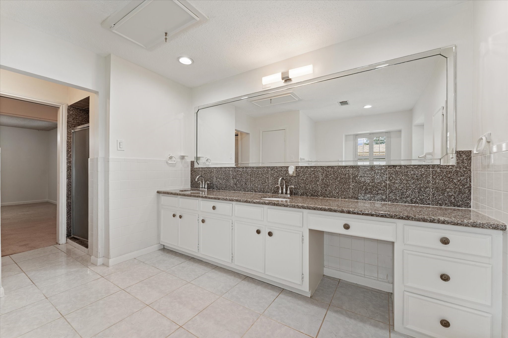 983 West Donovan Street Houston, TX 77091 - Photo 23 of 46 Primary Ensuite view 2 with double sinks with vanity and plenty of counter space and cabinets, separate shower, and water closet