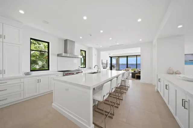 a kitchen with a sink cabinets and a window