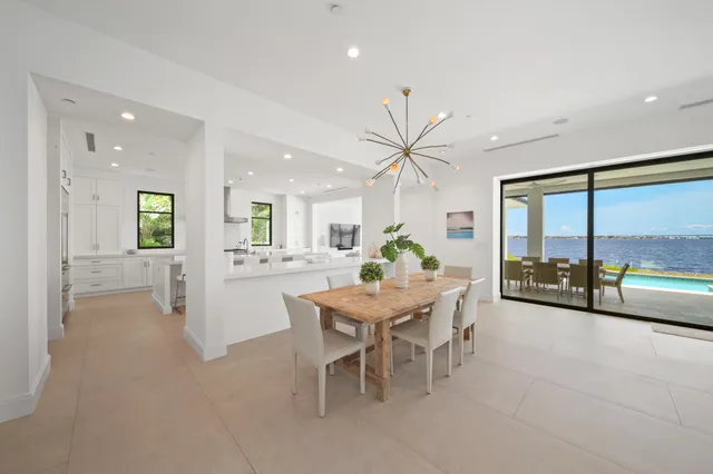 a living room with furniture tv and a large window