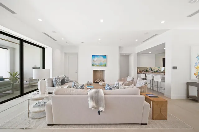 a spacious bathroom with a tub sink and mirror