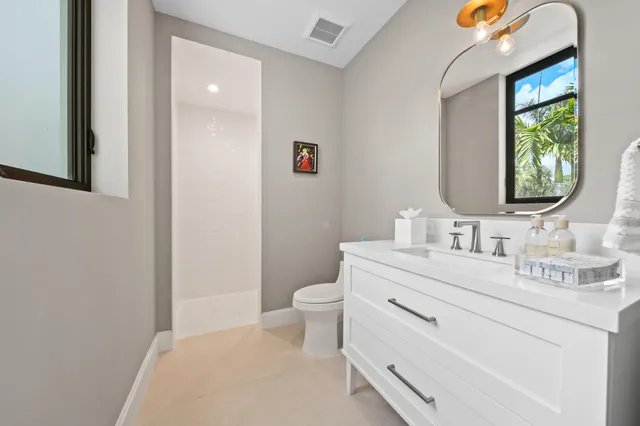 a bedroom with a large bed and a large window