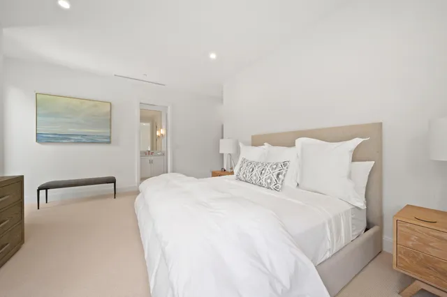 a bathroom with a double vanity sink mirror and toilet