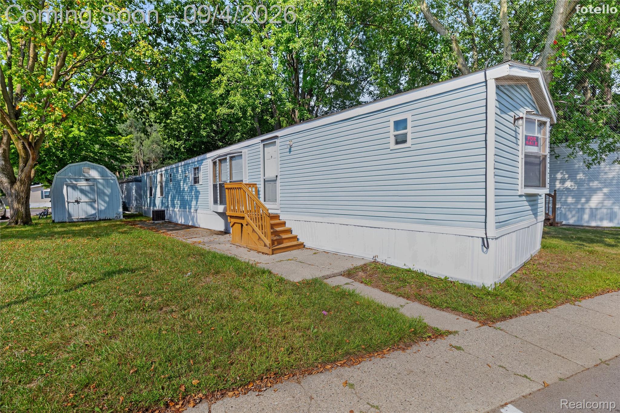 51074 Mott Road, Unit 200 Canton, MI 48188 - Photo 1 of 24 Light blue vinyl siding exterior with white trim