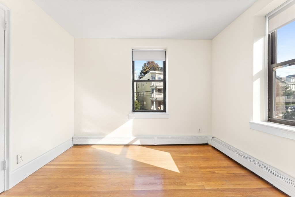 11 Victory Road, Unit 32 Boston, MA 02122 - Photo 5 of 16 an empty room with window