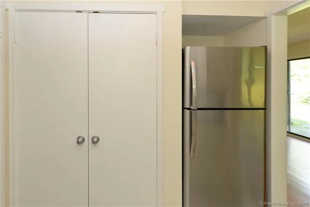 a bathroom with a glass shower door