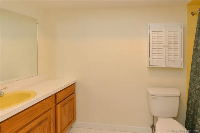 a bathroom with a toilet and a sink