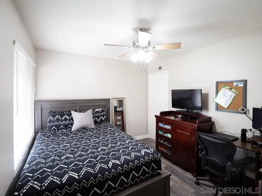 14018 Twin Peaks Road Poway, CA 92064 - Photo 13 of 27 a bedroom with a bed and a flat screen tv