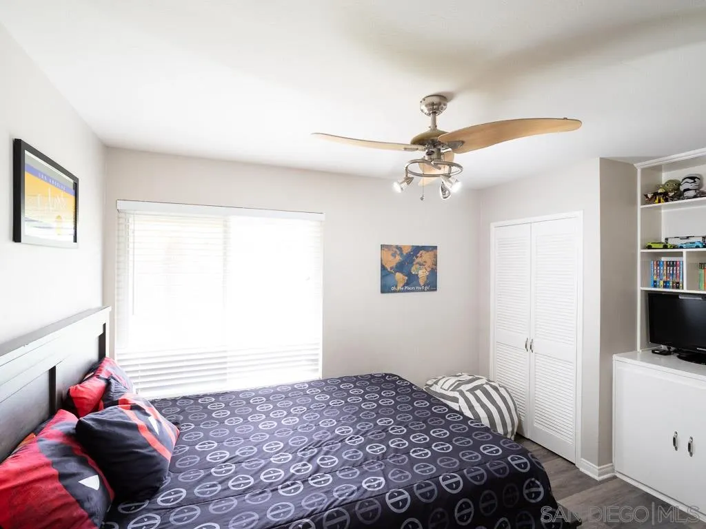 14018 Twin Peaks Road Poway, CA 92064 - Photo 14 of 27 a bedroom with a bed and a tv