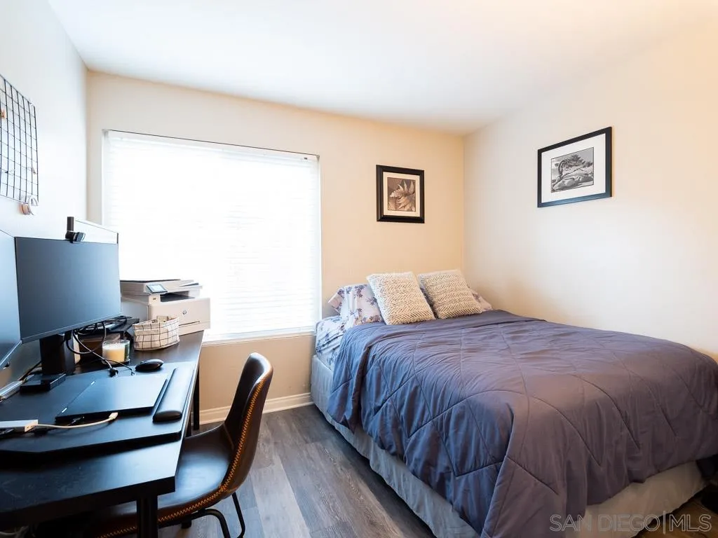 14018 Twin Peaks Road Poway, CA 92064 - Photo 16 of 27 a bedroom with a bed and a desk