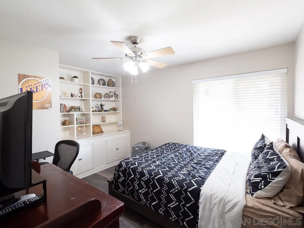 14018 Twin Peaks Road Poway, CA 92064 - Photo 17 of 27 a bedroom with a large bed and a window
